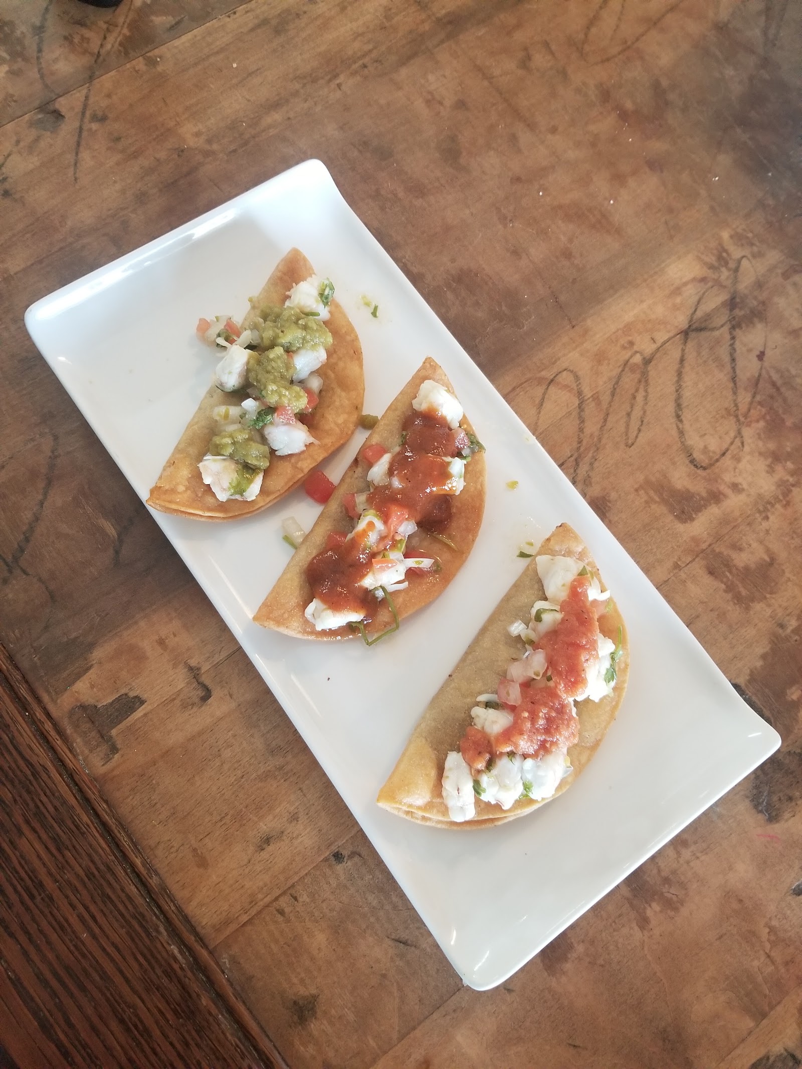 Shrimp ceviche tostadas topped with fresh pico de gallo and salsa