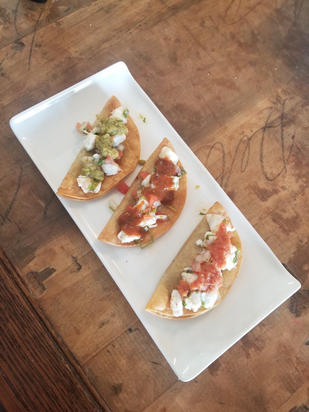 Shrimp ceviche tacos topped with fresh salsa