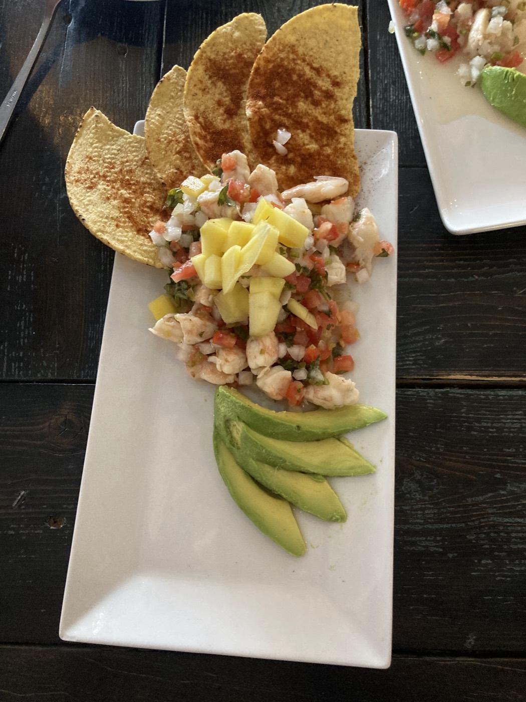 Torta sandwich with tortilla chips and Mexican beer